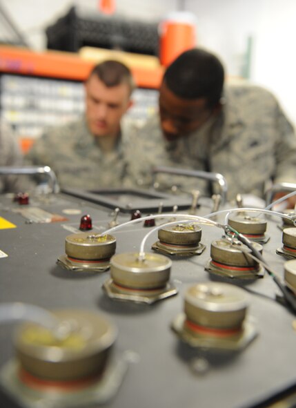 Staff Sgt. Michael Dickerson and Tech. Sgt. Mandigo Alfred, 2nd Maintenance Operations Squadron weapons quality assurance inspectors, inspect the tool box for a Multi-Use System Tester Armament Next Generation on Barksdale Air Force Base, La., June 28. Dickerson and Alfred ensured all the equipment used with the MUSTANG was accounted for and serviceable. (U.S. Air Force photo/Airman 1st Class Benjamin Gonsier)(RELEASED)