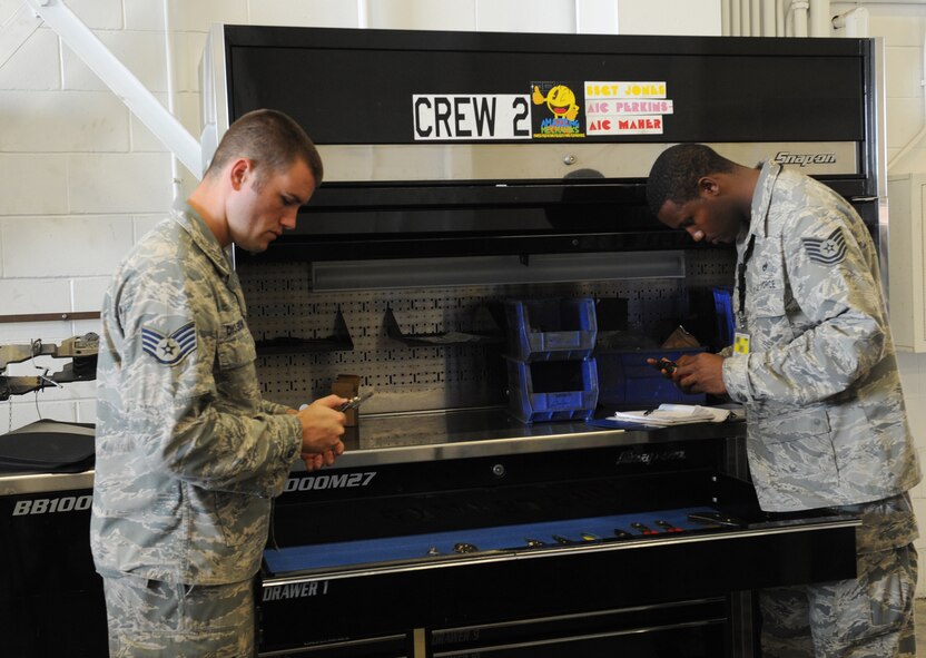 Staff Sgt. Michael Dickerson and Tech. Sgt. Mandigo Alfred, 2nd Maintenance Operations Squadron weapons quality assurance inspectors, check equipment during an inspection on Barksdale Air Force Base, La., June 28. Dickerson and Alfred ensured all equipment was properly marked and present and that all scheduled inspections were completed and signed off. (U.S. Air Force photo/Airman 1st Class Benjamin Gonsier)(RELEASED)

