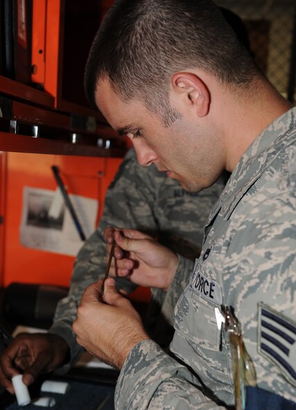 Staff Sgt. Michael Dickerson, 2nd Maintenance Operations Squadron weapons quality assurance inspector, inspects tools and equipment during an inspection on Barksdale Air Force Base, La., June 28. Quality assurance inspectors make sure all equipment is serviceable and accounted for. (U.S. Air Force photo/Airman 1st Class Benjamin Gonsier)(RELEASED)