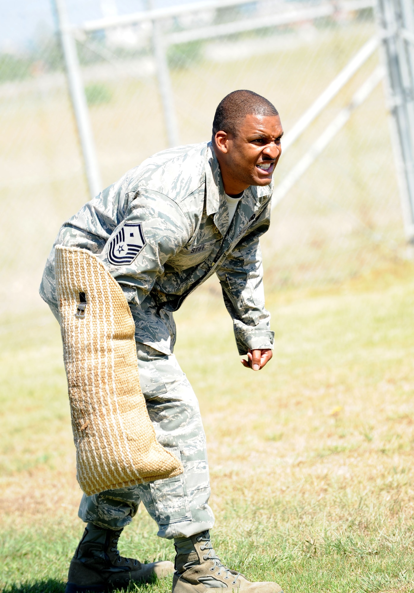 Master Sgt. Kevin Stiff, 39th Security Forces Squadron first sergeant, prepares for battle with a military working dog during a suspect pursuit demonstration June 29, 2012, at Incirlik Air Base, Turkey. As the new 39th SFS first sergeant, Stiff participated in the demonstration to get first-hand knowledge of daily operations of the MWD section. (U.S. Air Force photo by Senior Airman Jarvie Z. Wallace/Released)