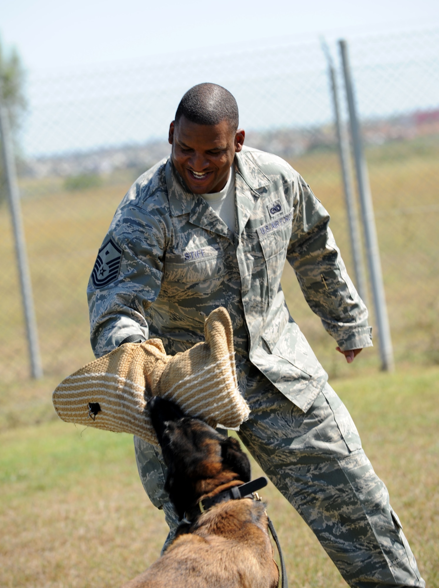 Military working dog Kira attacks Master Sgt. Kevin Stiff, 39th Security Forces Squadron first sergeant, during a suspect pursuit demonstration June 29, 2012, at Incirlik Air Base, Turkey. As the new 39th SFS first sergeant, Stiff participated in the demonstration to get first-hand knowledge of daily operations of the MWD section. (U.S. Air Force photo by Senior Airman Jarvie Z. Wallace/Released)