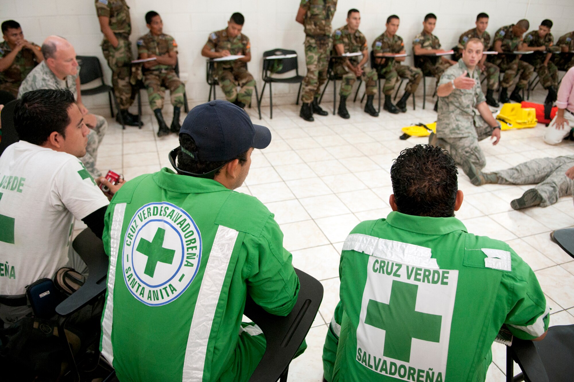 Members of Green Cross, a volunteer civil organization in El Salvador, listen as Tech. Sgt. Shawn Theberge offers his expereinces as a first responder during a subject matter expert exchange with members of the Salvadoran Army and other local civil authorities June 27, 2012. Members of the 157th Medical Group are in El Salvador for the exchange as part of the New Hampshire and El Salvador state partnership program. (N.H. National Guard photo by Tech. Sgt. Mark Wyatt/RELEASED)