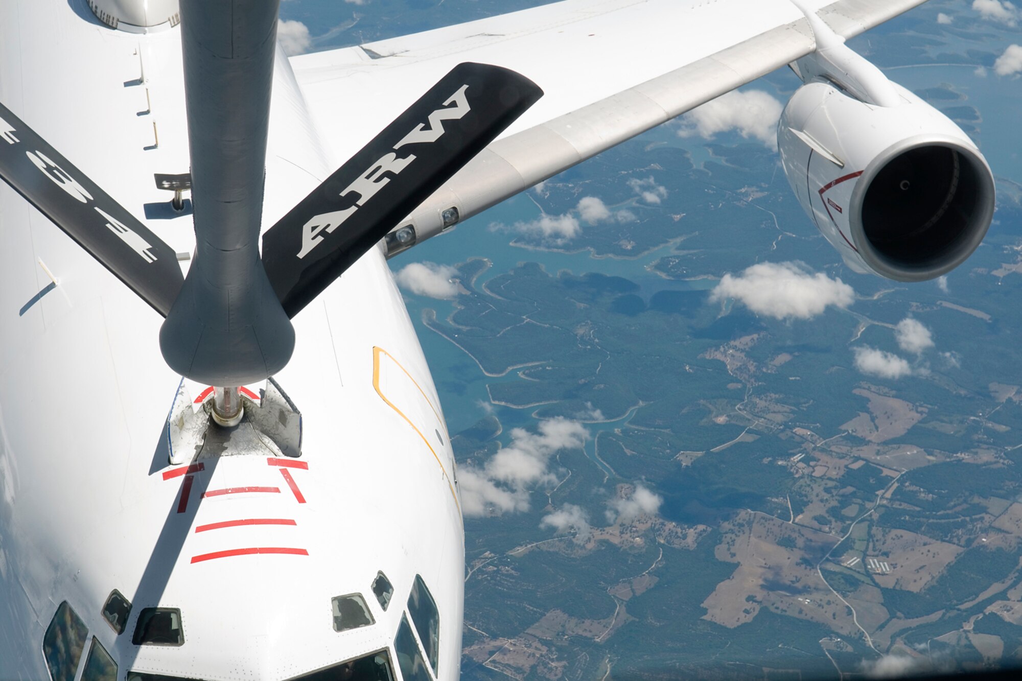 GRISSOM AIR RESERVE BASE, Ind. -- A KC-135R Stratotanker with the 434th Air Refueling Wing refuels a Navy E-6B Mercury from Tinker Air Force Base, Okla., June 20. Grissom honorary commanders and local civic leaders flew aboard the KC-135R to learn about the mission of the 434th ARW. (U.S. Air Force photo/Senior Airman Andrew McLaughlin)
