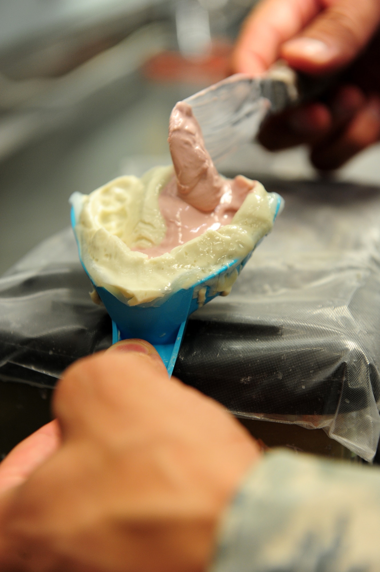 Staff Sgt. Brad Weeks, 86th Dental Squadron, dental laboratory technician, makes an alginate impression in the lab at the Dental Clinic on Ramstein Air Base, Germany, June 12, 2012.  (U.S. Air Force photo/Airman 1st Class Holly Cook)  
