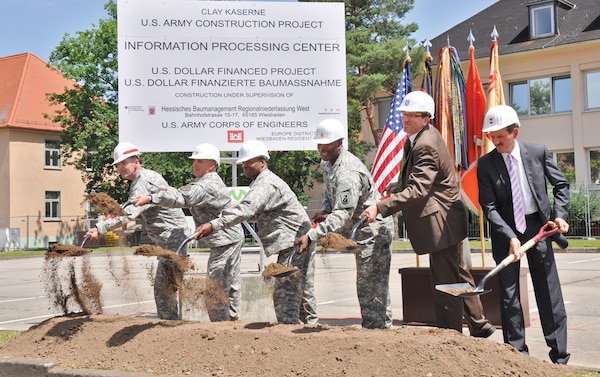 WIESBADEN, Germany — Col. D. Peter Helmlinger (from left), commander of the U.S. Army Corps of Engineers Europe District; Col. David Carstens, U.S. Army Garrison Wiesbaden commander; Col. Bruce Crawford, commander of the 5th Signal Command; 5th Signal Command Sgt. Maj. Gerald Tyce; Wolfgang Schnitzer of the Hessen Construction Management Agency; and Bertram Giesinger with the Wolff-Mueller construction firm break ground on the new Information Processing Center on Wiesbaden's Clay Kaserne, June 28, 2012.