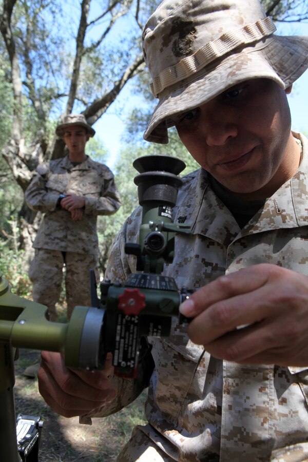 Cpl. Marcos Taveras, right, a mortarman with Charlie Company, Battalion Landing Team 1st Battalion, 2nd Marine Regiment, 24th Marine Expeditionary Unit, serves as a translator for the Marines of his company while they discuss various tactics with Spanish infantry Marines here, April 16, 2012, during bi-lateral tactics training between the 24th MEU and the Spanish Marine Corps. The 24th MEU, partnered with the Navy's Iwo Jima Amphibious Ready Group, is currently deployed as a theater reserve and crisis response force capable of a variety of missions from full-scale combat operations to humanitarian assistance and disaster relief.