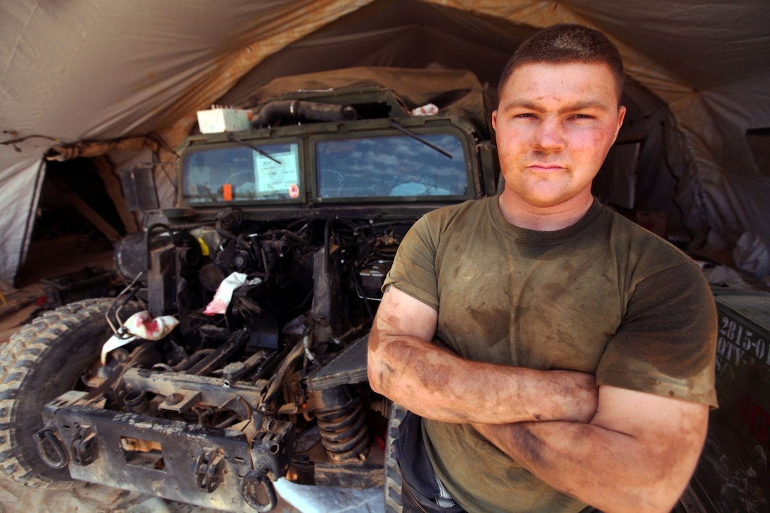 Lance Cpl. Bryan Planty, a motor transportation mechanic with Combat Logistics Battalion 24, 24th Marine Expeditionary Unit, poses for a picture during a break in replacing a Humvee’s engine here, May 6, 2012, during Exercise Eager Lion 12, the largest recurring exercise in the Central Command area of operations. More than 1,000 Marines and sailors from the 24th MEU are planned to participate in various events ashore throughout Jordan to maximize multilateral training opportunities and continue to build relationships with partners throughout the region. Eager Lion 12 is the second major exercise for the 24th MEU and Iwo Jima Amphibious Ready Group after deploying in March to serve as a forward-deployed crisis response force.