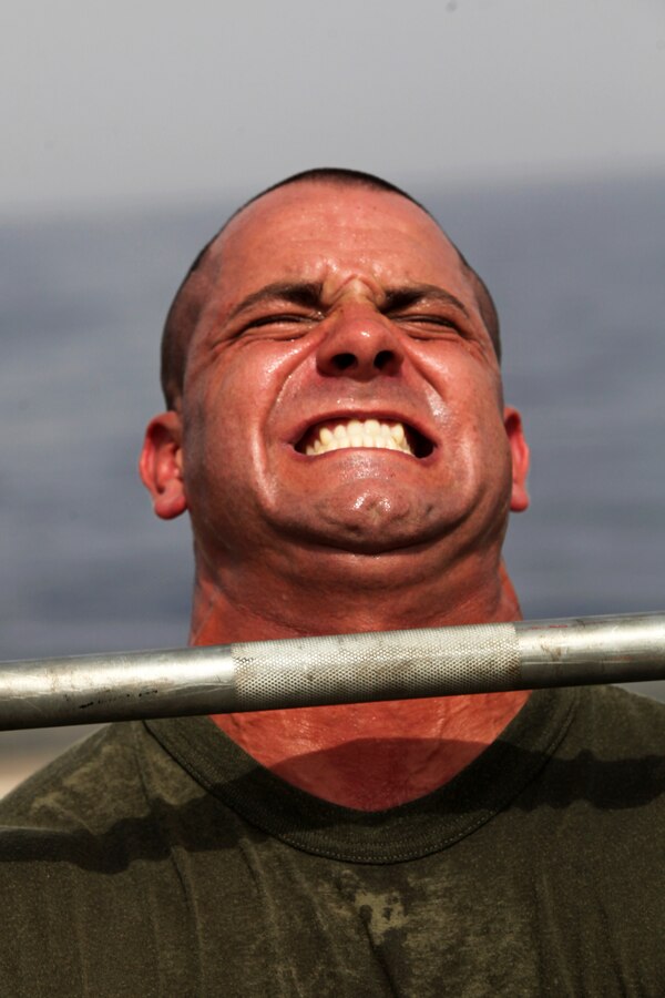 Staff Sgt. Jeffrey Perry, a Middlesex, N.J., native and the motor transportation chief with Motor Transportation Platoon, Combat Logistics Battalion 24, 24th Marine Expeditionary Unit, lifts weights during a CrossFit workout on the flight deck of the USS Gunston Hall, June 14, 2012. The 24th MEU, along with the Iwo Jima Amphibious Ready Group, is currently deployed to the U.S Central Command area of operations as a theater reserve and crisis response force. The group is providing support for maritime security operations and theater security cooperation efforts in the U.S. Navy's 5th Fleet area of responsibility.