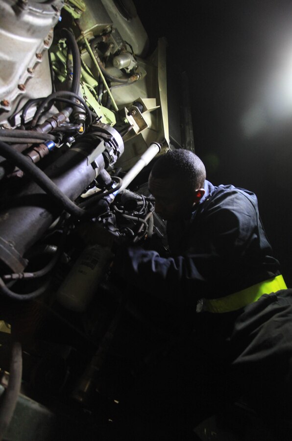 A Marine assigned to Alpha Company, Battalion Landing Team 1st Battalion, 2nd Marine Regiment, 24th Marine Expeditionary Unit, loosens bolts on an engine removed from an Assault Amphibious Vehicle (AAV) while ashore, June 22, 2012. The 24th MEU is deployed as part of the Iwo Jima Amphibious Ready Group, a U.S. Central Command theater reserve force providing support for maritime security operations and theater security cooperation efforts in the U.S. 5th Fleet area of responsibility.