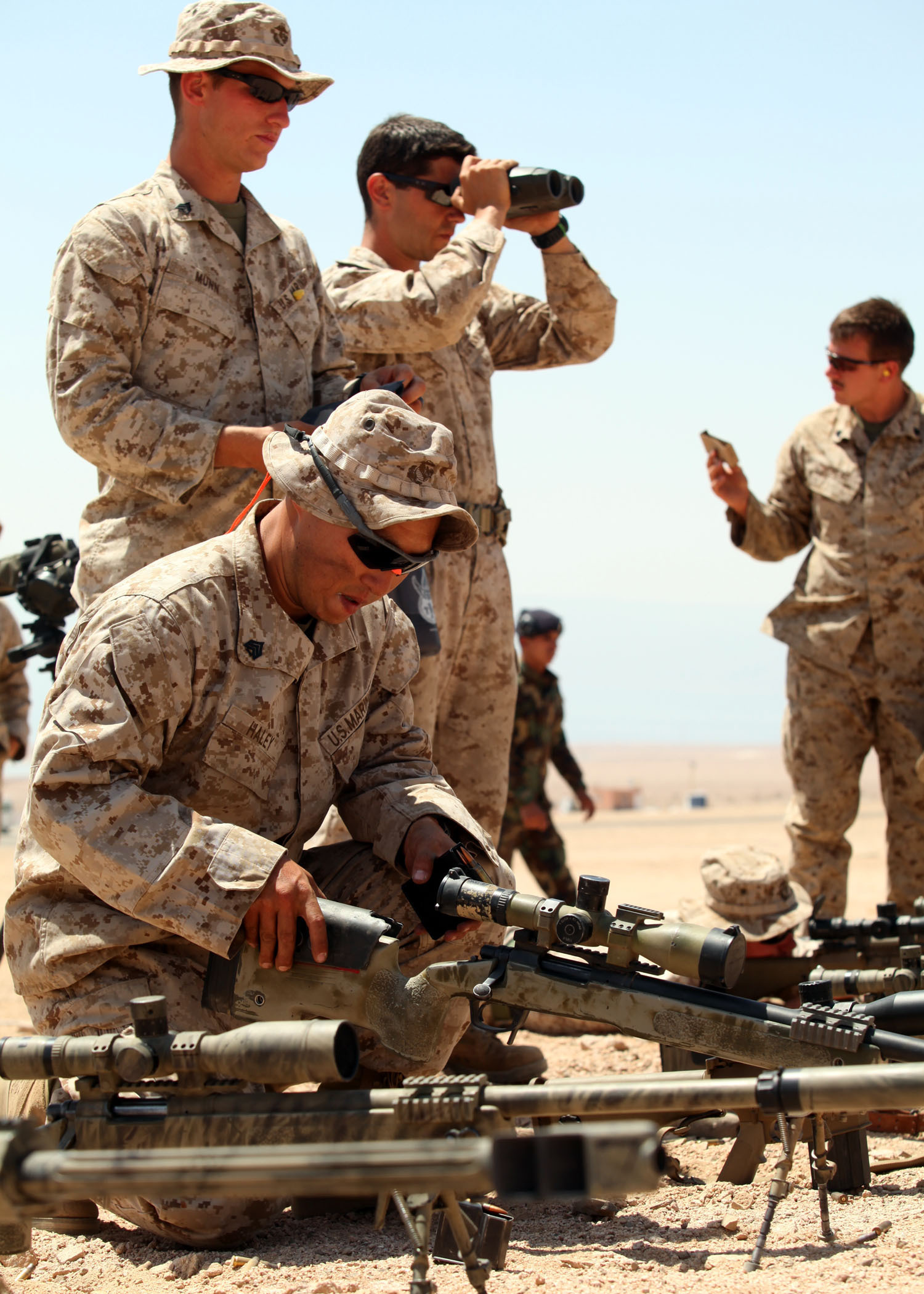 Marines with the Maritime Raid Force, 24th Marine Expeditionary Unit, prepare an assortment of sniper rifles in preparation for live-fire bilateral training with the Jordanian 77th Marine Reconnaissance Battalion here, May 9, 2012. The bilateral training is part of Exercise Eager Lion 12, taking place throughout the month of May and designed to strengthen military-to-military relationships of over 19 participating partner nations. This is the second major exercise for the 24th MEU who, along with the Iwo Jima Amphibious Ready Group, is currently deployed as a theater security and crisis response force.