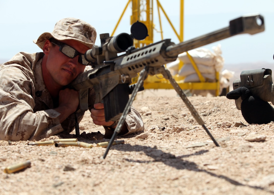 Staff Sgt. Zachary Burghart, a Maritime Raid Force team leader, 24th Marine Expeditionary Unit, verifies scope settings on an M107 .50 cal Special Application Scoped Rifle, or SASR, during bilateral live-fire training with members of the Jordanian 77th Marine Reconnaissance Battalion here, May 8, 2012. The bilateral training is part of Exercise Eager Lion 12, taking place throughout the month of May and designed to strengthen military-to-military relationships of over 19 participating partner nations. This is the second major exercise for the 24th MEU who, along with the Iwo Jima Amphibious Ready Group, is currently deployed as a theater security and crisis response force.