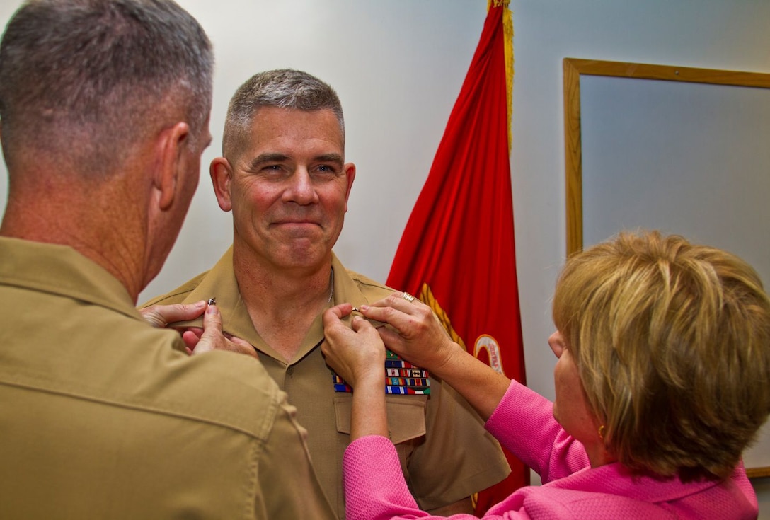 Major Gen. Joseph L. Osterman, commanding general, Marine Corps Recruiting Command, is promoted to his current rank by Gen. Joseph F. Dunford, Jr., Assistant Commandant of the Marine Corps, during a ceremony here July 2. Major General Osterman, a native of Edgewater, Md., thanked his family for their devotion and sacrifice during his career and asked his wife, Jennifer, to assist in pinning on his rank. He also took a moment to address the MCRC headquarters staff, and expressed his appreciation for their continued diligence and hard work under his command.