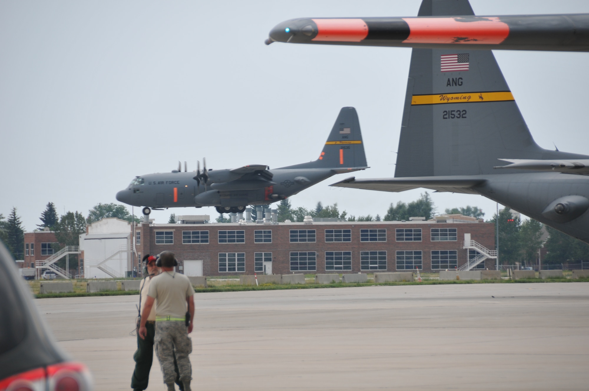A MAFFS-equipped C-130 prepares to land at the Wyoming Air National Guard base in Cheyenne, Wyo., July 3, 2012. MAFFS aircraft continue to operate in the Rocky Mountain region to assist with firefighting efforts. (U.S. Air Force photo by Airman 1st Class Nichole Grady)