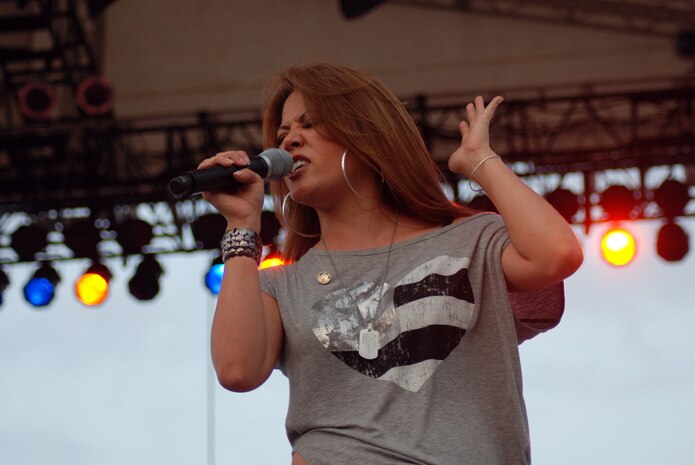 Angie Johnson, who competed on NBC's "The Voice" this past March, performs during the annual Independence Day Celebration at McConnell Talbert Memorial Stadium in Warner Robins, Ga., July 2. (U.S. Air Force photo/Bo Joyner)