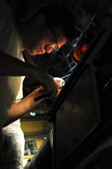 Airman 1st Class Michael Romanyak, 2nd Maintenance Squadron, cuts a rivet in the tail section of a B-52H Stratofortress on Barksdale Air Force Base, La., July 2. Romanyak enjoys riding dirt bikes and competing in local Motocross competitions in his spare time. According to Romanyak, the activity helps him come back to work refreshed and ready to support the mission. (U.S. Air Force photo/Airman 1st Class Micaiah Anthony)(RELEASED)