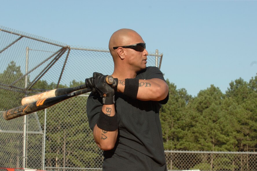 Tech Sgt. Frank Mamea, 20th Security Forces Squadron flight chief and a native of Long Beach, Calif., swings two bats to warm up before stepping up to the plate during a softball game at Shaw Air Force Base, S.C., June 27, 2012. 20th SFS played against 20th Medical Group and 20th SFS won 15 - 11. (U.S. Air Force photo by Airman 1st Class Krystal M. Jeffers/Released) 