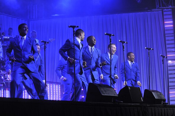 All of the male members of the Tops In Blue troop perform a song together during their concert for the Great Falls community June 27 at the Montana ExpoPark.  Tops In Blue travels the United States and to 20 different countries performing for military personnel and their families. (U.S. Air Force photo/John Turner)