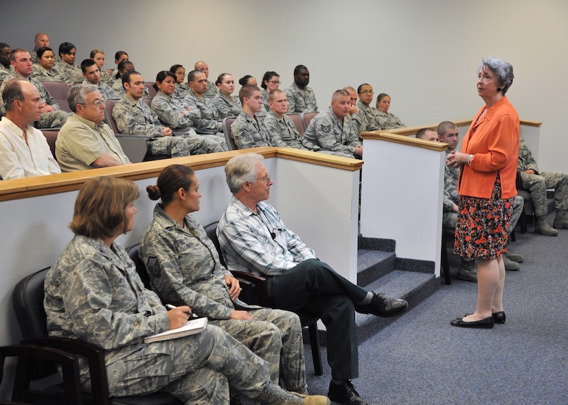 Ann Mitchell, Logistics and Mission Support for Air Force Global Strike Command director of installations, praises members of the 341st Logistics Readiness Squadron for their dedication to the mission during an LRS all-call on June 28. (U.S. Air Force photo/John Turner)
