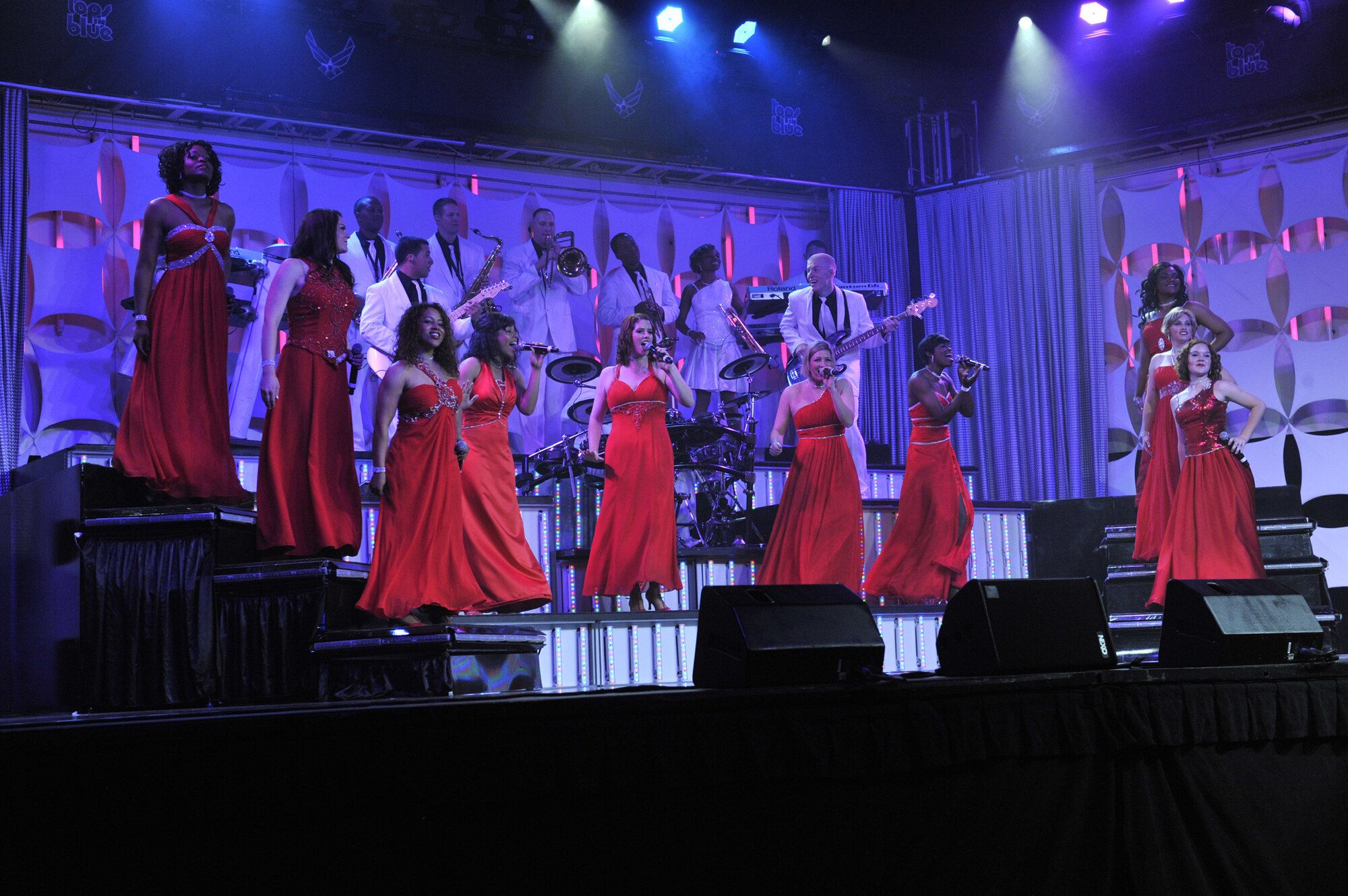 Members of the 2012 Tops In Blue troop perform a song for the Malmstrom Air Force Base and Great Falls communities June 27 at the Montana ExpoPark.  Their show, titled “Listen,” engaged the audience through a dynamic array of rhythms and sounds they may hear every day. (U.S. Air Force photo/John Turner)