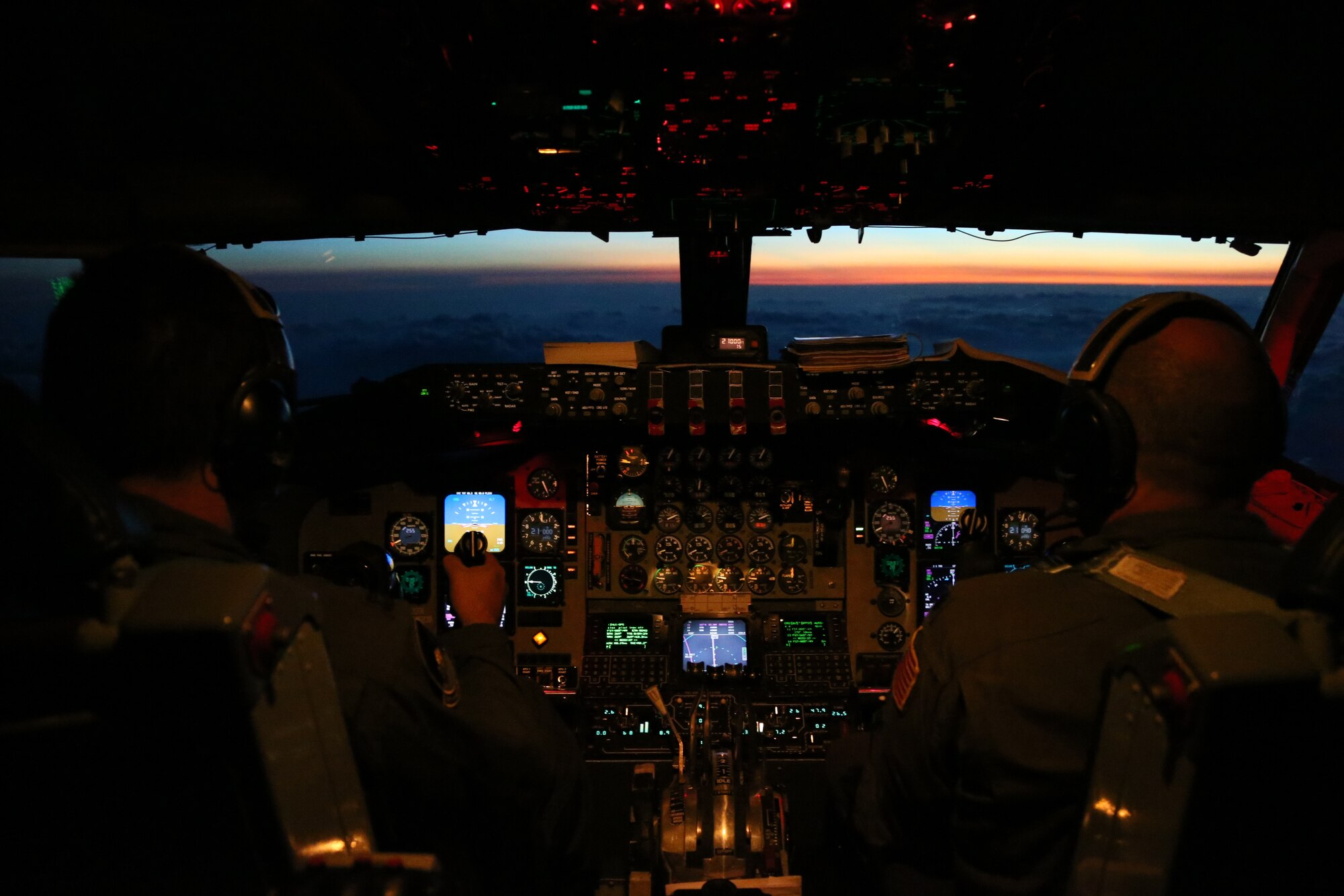 Pilots from the 459th Air Refueling Wing fly into the Texas sunset during a refueling mission, June 28. The 459 ARW is assisting the 356th Airlift Squadron for a business effort where new Lockheed C-5 Galaxy aircraft pilots get qualified on aerial refueling. (U.S. Air Force photo/Senior Airman Katie Spencer)