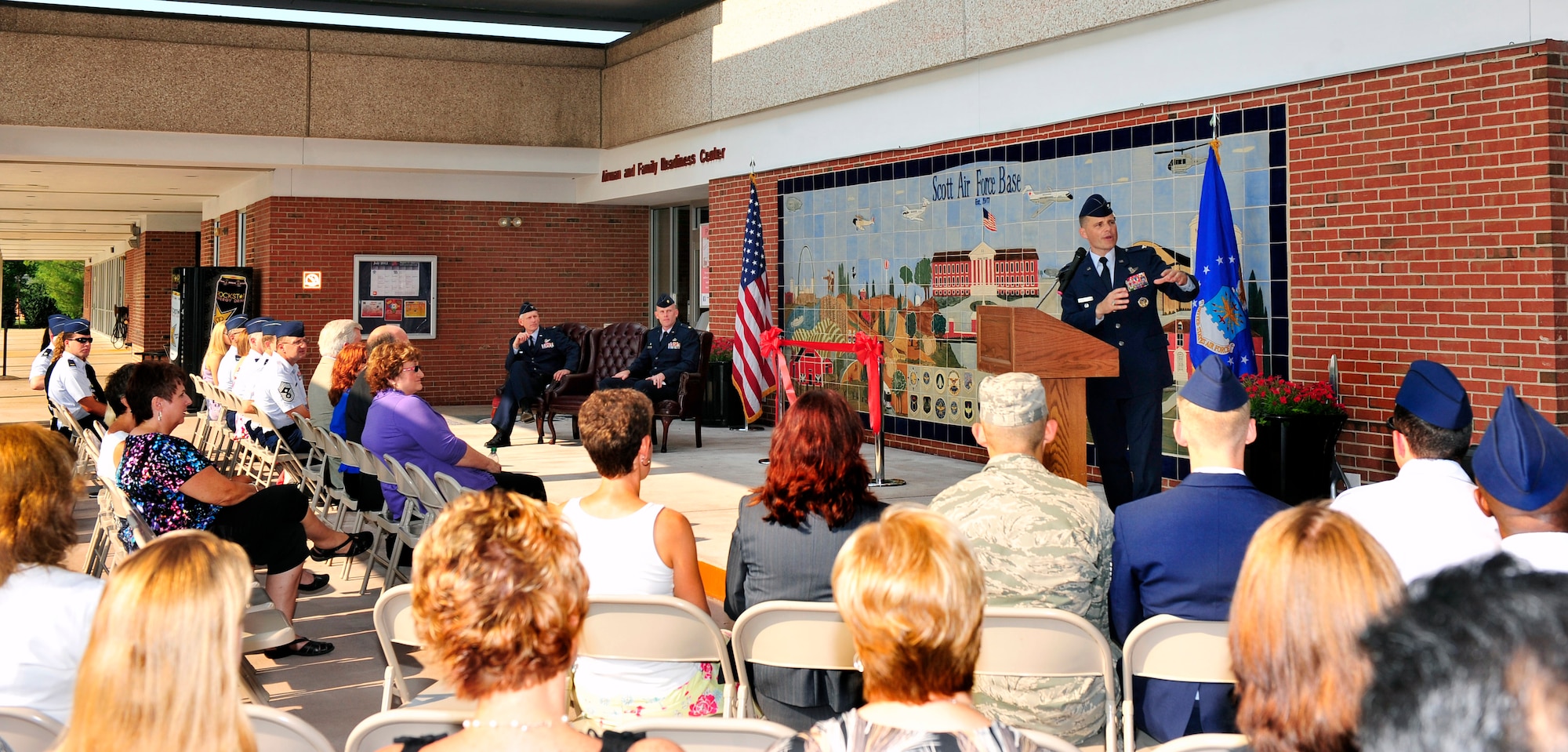 Former commander, retired Col. Michael Hornitschek, talks at the grand opening of the new Student Union on Scott Air Force Base, Ill June 2, 2012. The idea for a Student Union, the first in Air Mobility Command, came as a way to support and reinforce the ideas found in the Comprehensive Airman Fitness philosophy, and was championed by Hornitschek. It will provide a new place for Team Scott members and students to use for recreational activities and studying. Also inside the educational center will was reconstructed to provide three more classrooms and a Cafe that will open in mid-August. ( U.S. Air Force photo/ Staff Sgt. Stephenie Wade)