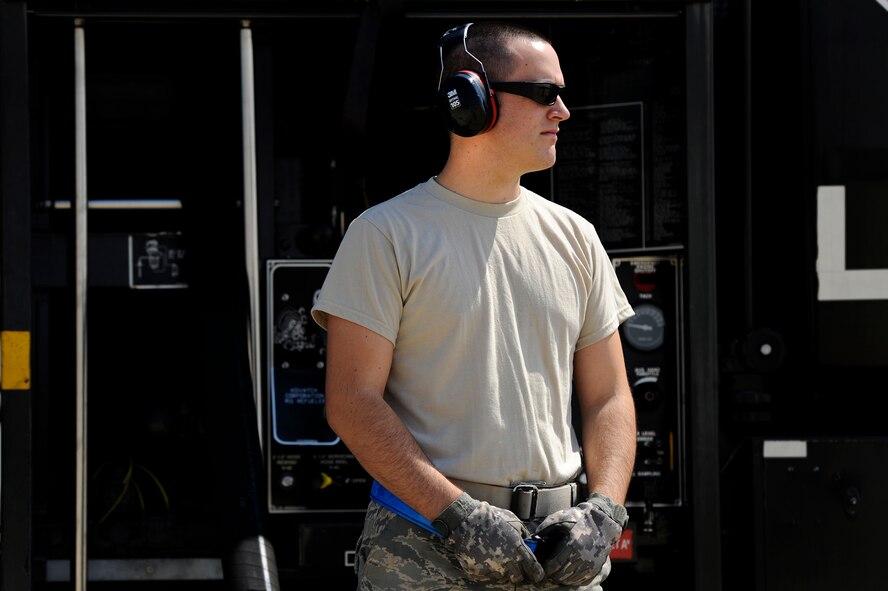 U.S. Air Force Airman 1st Class Jason Hole, 20th Logistics Readiness Squadron fuels operator, observes a hot pit refuel for an F-16 Fighting Falcon, June 26, 2012, Shaw Air Force Base, S.C. Hot pit refueling is a procedure usually performed in a combat situation to rapidly refuel aircraft while their engines are running resulting in a speedy refuel to thrust pilots right back into the fight. Airmen assigned to the 20th Logistics Readiness Squadron and 20th Aircraft Maintenance Squadron practice this technique to keep their skills sharp and aid in the effort to provide combat ready air power at a moment’s notice. (U.S. Air Force photo by Senior Airman Kenny Holston/Released)