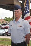 Airman Luke Bolen, who recovered from Guillain-Barre Syndrome, stands in front of the U.S. flag during the Air Force Basic Military Training graduation ceremony May 11 at the 321st Training Squadron. (U.S. Air Force photo/Alan Boedeker)