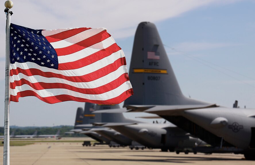 The American flag proudly flies in front of the 911th Airlift Wing’s C-130’s, June 14, 2012. The flag has been flown since the 4th of July in the year 1776. On that day, the Declaration of Independence was approved by the Continental Congress, setting the 13 colonies on the road to freedom as a sovereign nation. As always, this great American holiday will be marked by patriotic parades, amazing fireworks and backyard barbecues across the country. (U.S. Air Force photo illustration by Senior Airman Justyne Obeldobel/Released)