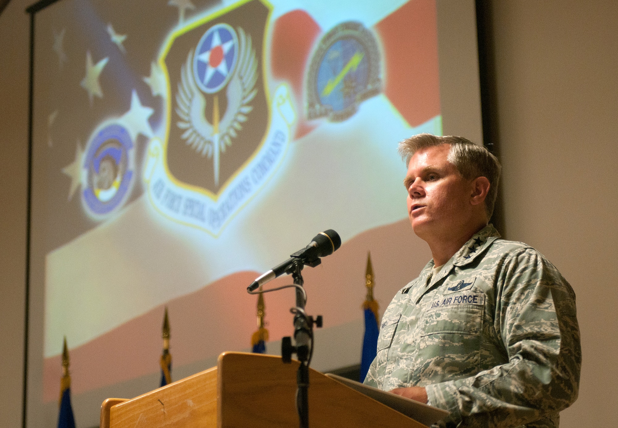 Lt. Gen. Eric Fiel, commander of the U.S. Air Force Special Operations Command, speaks at an award ceremony for members of the 123rd Special Tactics Squadron at the Kentucky Air National Guard Base in Louisville, Ky., on June 28, 2012. The adjutant general of the Commonwealth of Kentucky, Maj. Gen. Edward W. Tonini, was also on hand to present a Purple Heart and 10 other military decorations to the Airmen for their outstanding service in Iraq and Afghanistan. (U.S. Air Force photo by Master Sgt. Phil Speck)