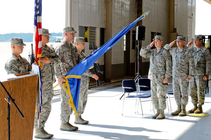 Members of the official party salute the flag during the national anthem at the 3d Weather Squadron’s change of command at Fort Hood, Texas, June 26, 2012. The 3d WS transferred command of the squadron from U.S. Air Force Lt. Col. Robert Coxwell to Lt. Col. Corey Hummel during the ceremony. (U.S. Air Force photo by Staff Sgt. Joshua J. Garcia/Released) 