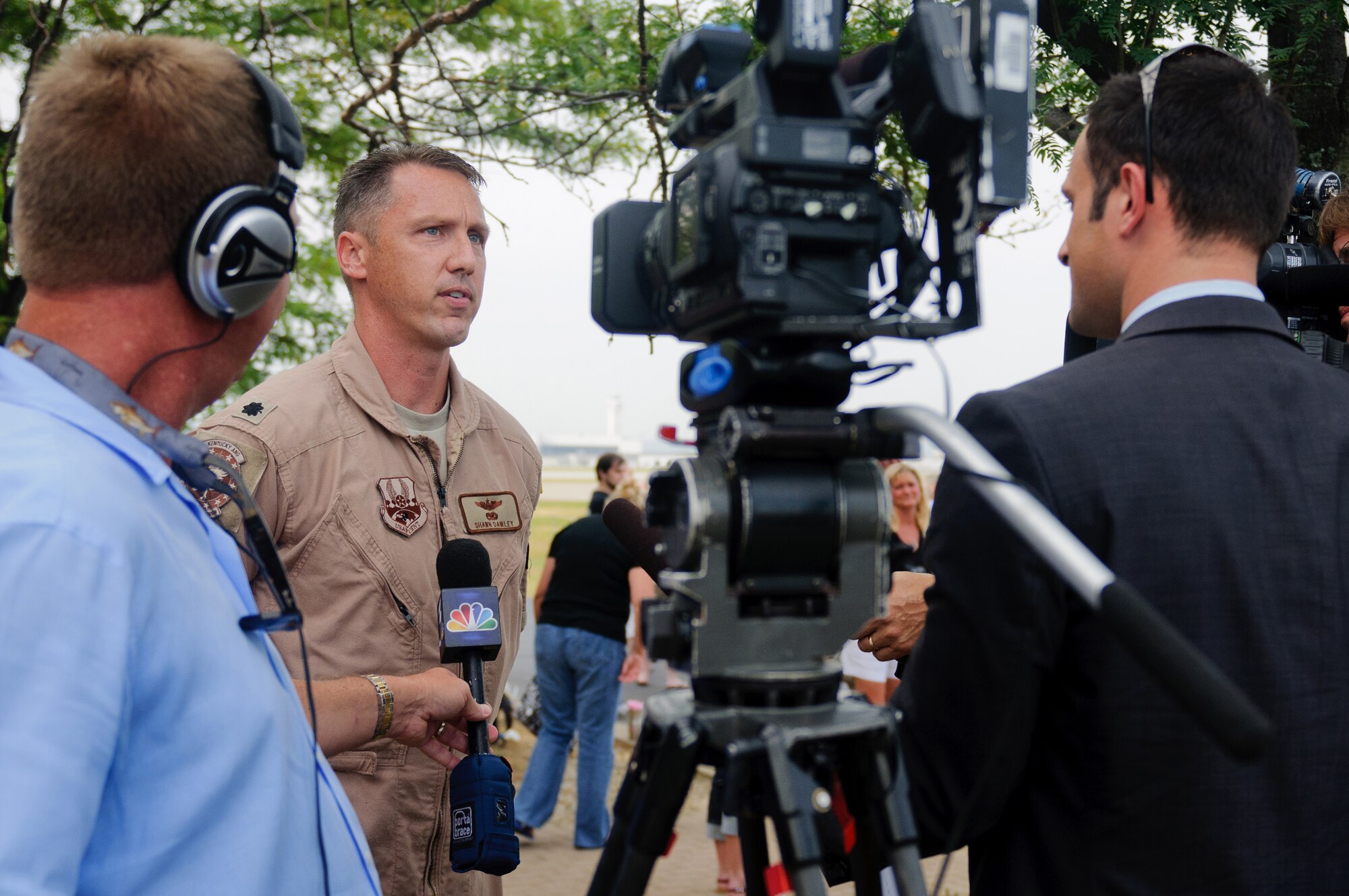 Lt. Col. Shawn Dawley, commander of the 165th Airlift Squadron, talks to local media at the Kentucky Air National Guard Base in Louisville, Ky., on July 2, 2012, prior to takeoff for a deployment. The 123rd Airlift Wing deployed 70 Airmen and two C-130 aircraft to the Persian Gulf region in support of operations Enduring Freedom and New Dawn. The deploying Airmen will operate from an undisclosed air base in Southwest Asia, flying troops and cargo across the U.S. Central Command Area of Responsibility as part of the 386th Air Expeditionary Wing. (U.S. Air Force photo by Master Sgt. Phil Speck)