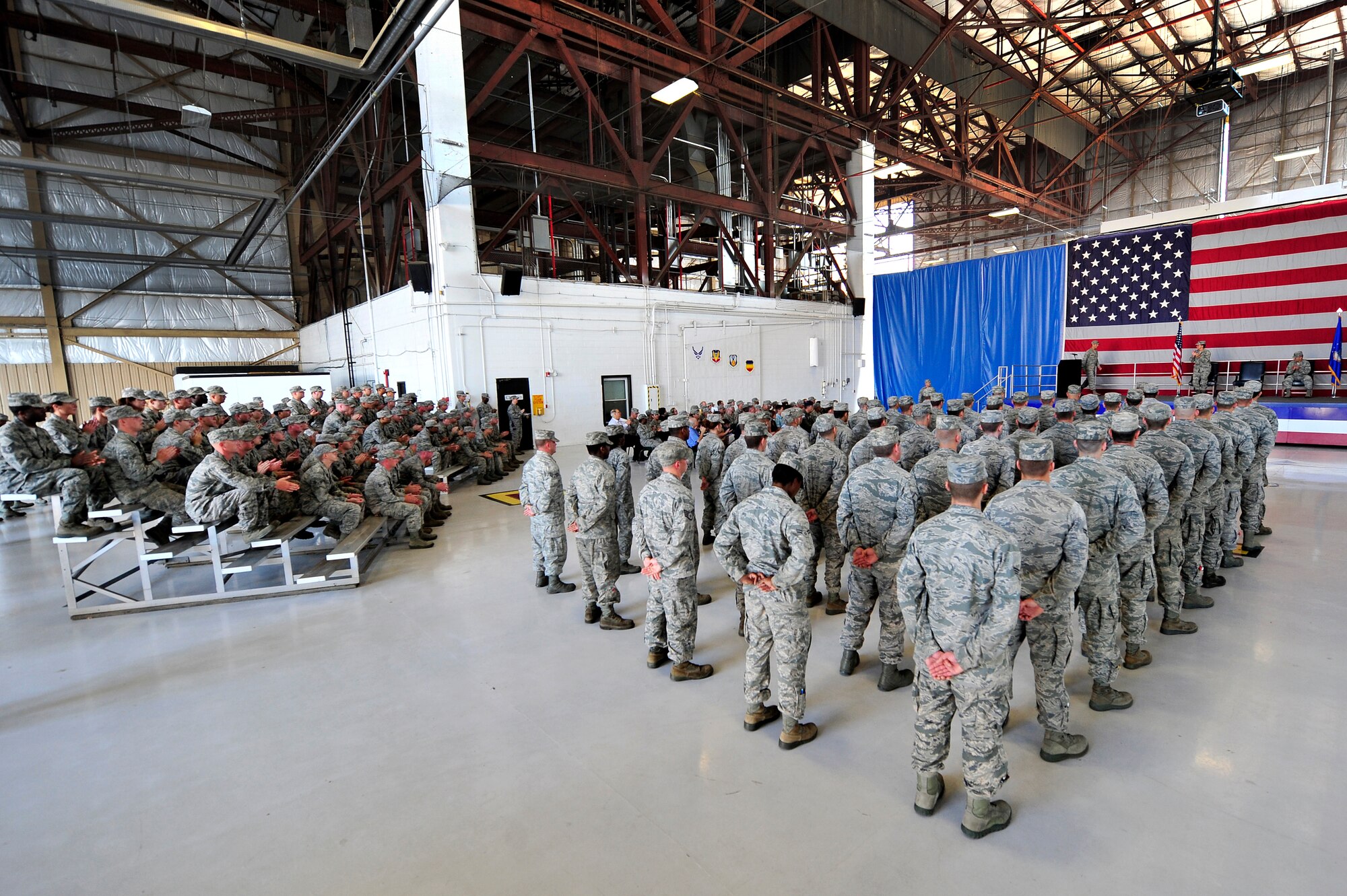 U.S. Air Force Airmen assigned to the 20th Equipment Maintenance Squadron attend a change of command ceremony to welcome their new command, Maj. Joshua Wennrich, June 29, 2012, Shaw Air Force Base, S.C. Lt. Col. James Smith relinquished command to Wennrich. Wennrich arrived at Shaw from Royal Air Force Lakenheath Air Base, England. (U.S. Air Force photo by Senior Airman Kenny Holston/Released) 