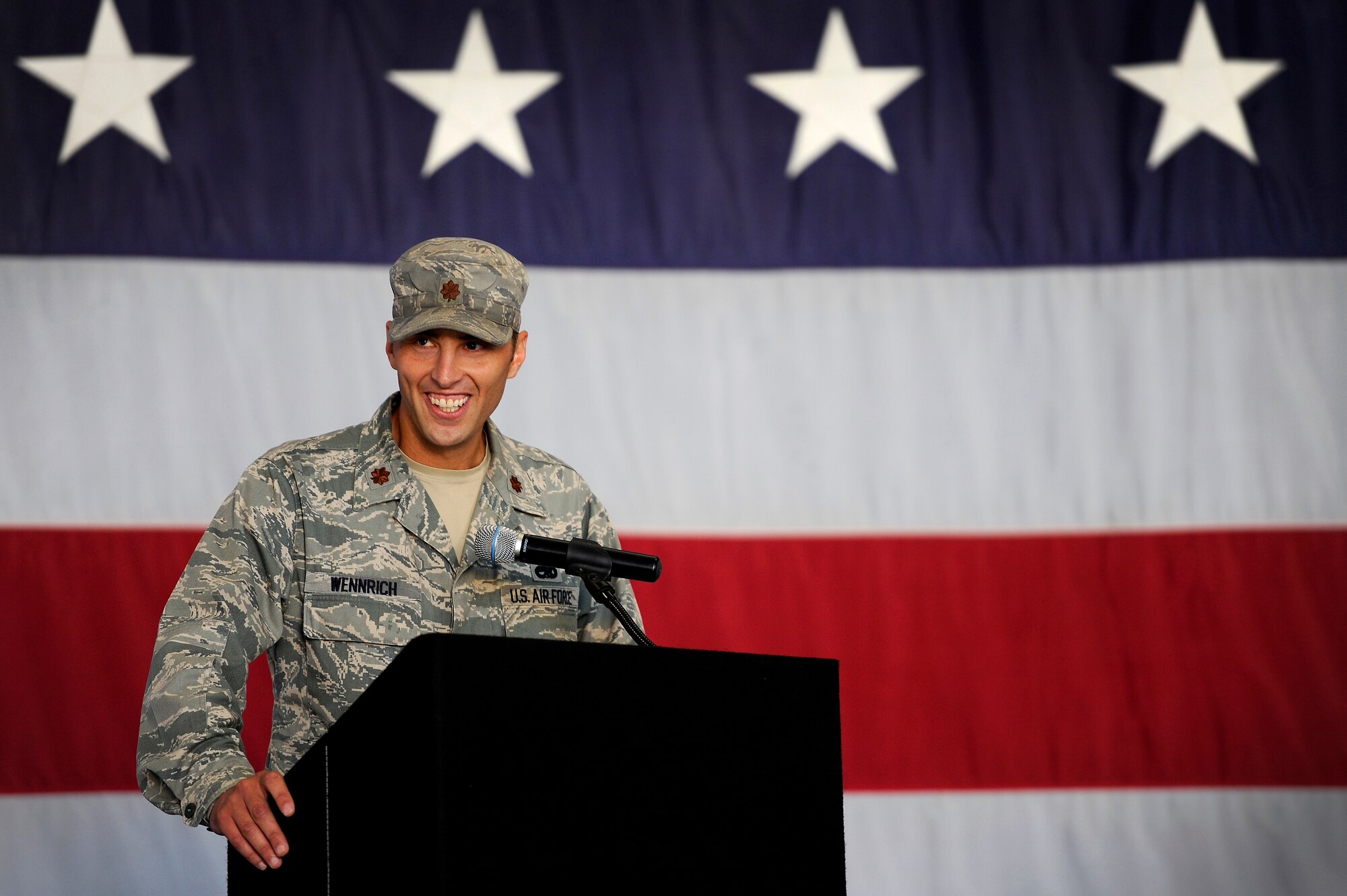 U.S. Air Force Maj. Joshua Wennrich, 20th Equipment Maintenance Squadron commander, takes the podium during a change of command ceremony to say a few words as he takes command of the 20th EMS, June 29, 2012, Shaw Air Force Base, S.C. Lt. Col. James Smith relinquished command to Maj. Joshua Wennrich. Wennrich arrived at Shaw from Royal Air Force Lakenheath Air Base, England. (U.S. Air Force photo by Senior Airman Kenny Holston/Released) 