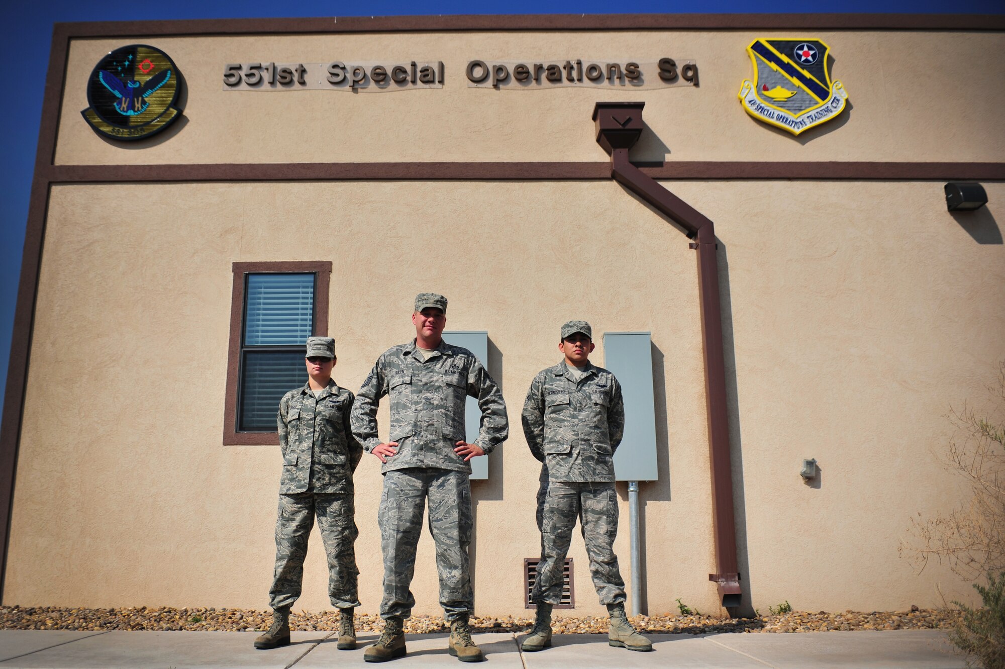 U.S. Air Force Master Sgt. Adam Bolen, 551st Special Operations Squadron first sergeant, stands with Airmen 1st Class Amanda Teague and Martin Hermosillo, 551 SOS, in front of their squadron at Cannon Air Force Base, N.M., July 3, 2012. Bolen talks about his concept of the Air Force Core Values and holding military members accountable in July's Diamond Notes submission. (U.S. Air Force photo by Airman 1st Class Alexxis Pons Abascal) 