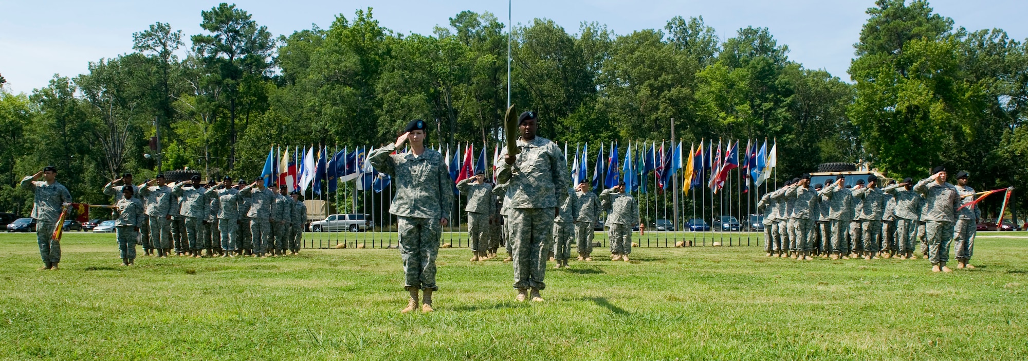 Soldiers from the 833rd Transportation Battalion salute the colors during the National Anthem at the unit's colors uncasing ceremony at Ft. Eustis, Va., July 2, 2012. The Army activated the unit July 28, 1942 as the Seattle Port of Embarkation, one of eight POEs supporting the U.S. war effort in the Pacific theater in World War II. (U.S. Air Force photo by Senior Airman John D. Strong II/Released)