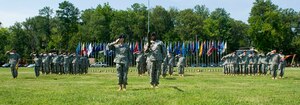 Soldiers from the 833rd Transportation Battalion salute the colors during the National Anthem at the unit's colors uncasing ceremony at Ft. Eustis, Va., July 2, 2012. The Army activated the unit July 28, 1942 as the Seattle Port of Embarkation, one of eight POEs supporting the U.S. war effort in the Pacific theater in World War II. (U.S. Air Force photo by Senior Airman John D. Strong II/Released)