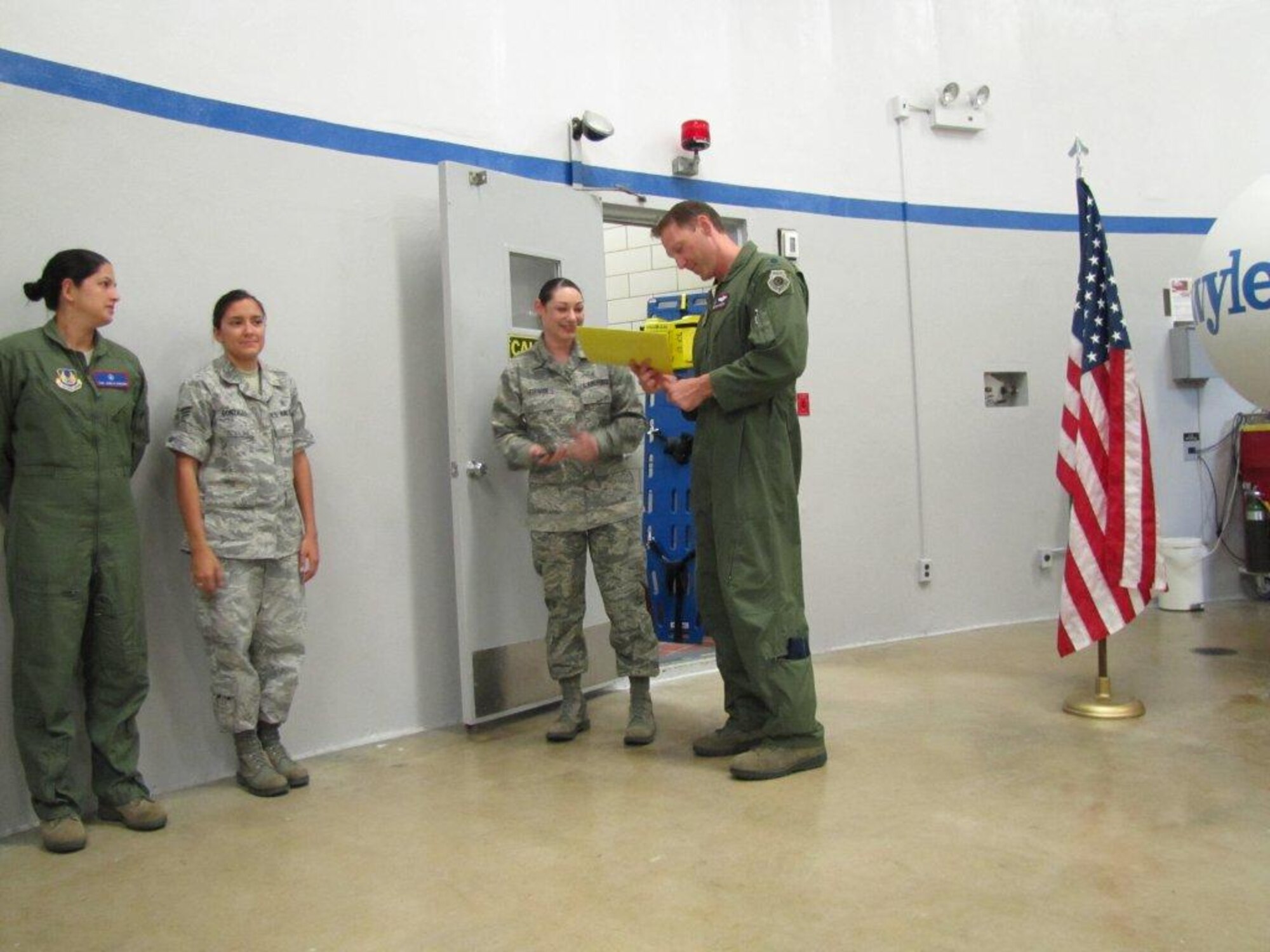 After reenlisting Staff Sgt. Sara Furman, Lt. Col. David Piffarerio, 302nd Fighter Squadron commander, speaks to those in attendance about the importance of her decision and her service to the Air Force.

Furman is a Cardiopulmonary Technician at Wilford Hall Ambulatory Surgery Clinic. The reenlistment was done in front of the Centrifuge at Brooks City Air Base, Texas where Piffarerio and a group of F-22 pilots were conducting testing. 

“I have never worked with such an elite team.  I was most honored and privileged to be truly among the best of the best," said Furman. "My service means so much more to me now. I won't let the legendary "Piff" down,.
(Courtesy Photo)