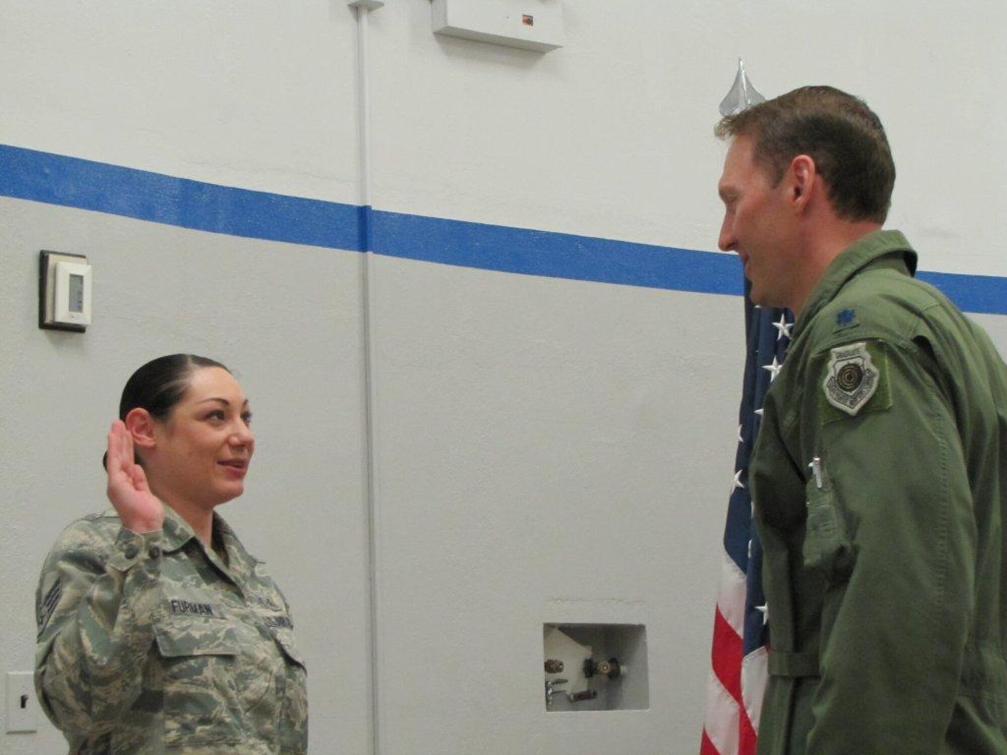 Lt. Col. David Piffarerio, 302nd Fighter Squadron commander, reenlists Staff Sgt. Sara Furman, Wilford Hall Ambulatory Surgery Clinic, Cardiopulmonary technician, in front of the Centrifuge at Brooks City Air Base, Texas.  Piffarerio was a part of a group of pilots conducting testing at the Centrifuge when he met Furman.
 
“I was impressed by how he presented himself.  It is always about the team for him. He is a true leader. He was always caring about the other pilots; making sure each one was okay,” said Furman. “I am so happy that I gained enough courage to ask Lt. Col. Piffarerio to conduct the oath.  My service means so much more to me now, so I won't let the legendary "Piff" down.”
(Courtesy Photo)
