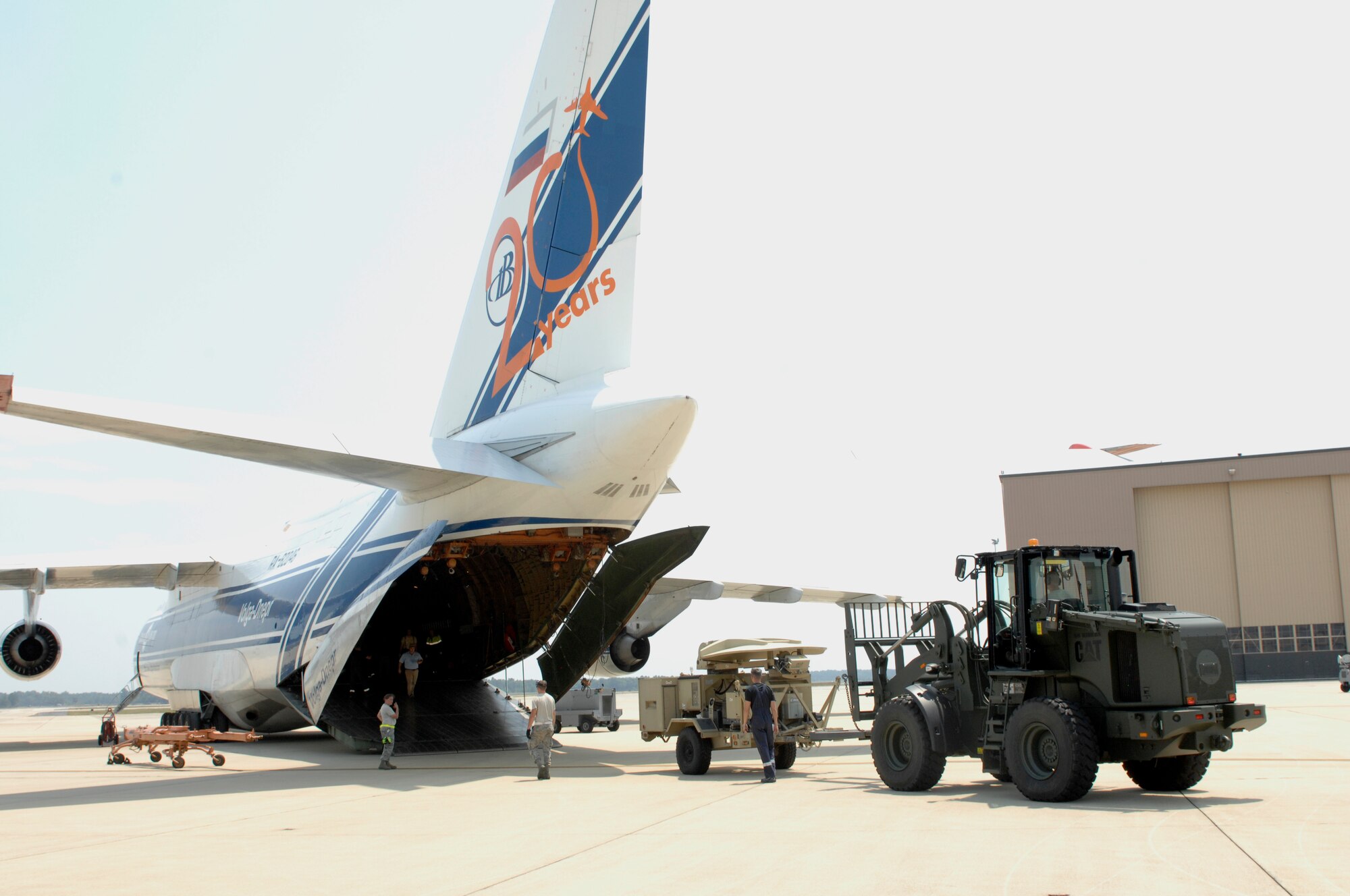 A communication satellite is loaded onto a Russian Antonov An-124 Ruslan by the 20th Logistics Readiness Squadron at Shaw Air Force Base, S.C., June 30, 2012. A second satellite, three mine-resistant ambush-protected vehicles and additional supplies, weighing a total of 135,000 pounds, were also loaded on to the plane. The plane left to deliver the cargo to the 8th Army in the Republic of Korea on July 2, 2012. (U.S. Air Force photo by Airman 1st Class Krystal M. Jeffers/Released)