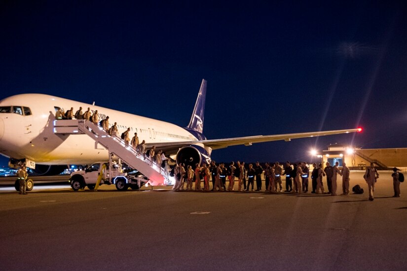 Airmen of the 16th Airlift Squadron, 437th Airlift Wing, return home from a deployment at Joint Base Charleston - Air Base, S.C., July 2, 2012. While deployed, the 16th AS served under the 816th Expeditionary Airlift Squadron, supporting combat operations in the U.S. Central Command area of responsibility. (U.S. Air Force photo by Airman 1st Class George Goslin/Released)