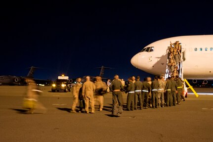 Airmen of the 16th Airlift Squadron, 437th Airlift Wing, return home from a deployment at Joint Base Charleston - Air Base, S.C., July 2, 2012. While deployed, the 16th AS served under the 816th Expeditionary Airlift Squadron, supporting combat operations in the U.S. Central Command area of responsibility. (U.S. Air Force photo by Airman 1st Class George Goslin/Released)