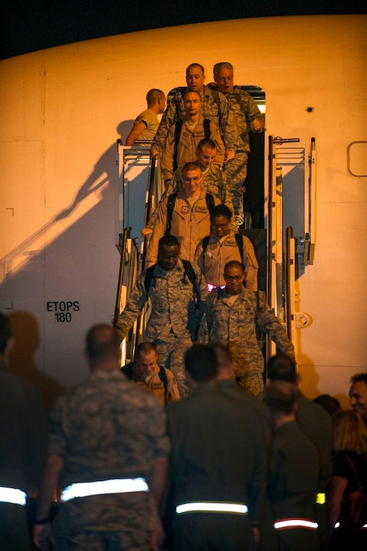 Airmen of the 16th Airlift Squadron, 437th Airlift Wing, return home from a deployment at Joint Base Charleston - Air Base, S.C., July 2, 2012. While deployed, the 16th AS served under the 816th Expeditionary Airlift Squadron, supporting combat operations in the U.S. Central Command area of responsibility. (U.S. Air Force photo by Airman 1st Class George Goslin/Released)