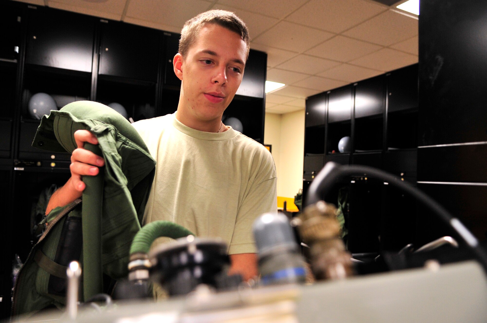 U.S. Air Force Airman Jesse Seeber, 79th Fighter Squadron aircrew flight equipment journeyman, conducts a leakage test on an anti-gravity flight suit at Shaw Air Force Base, S.C., July 2, 2012.  Aircrew flight equipment personnel are responsible for ensuring the safety of the fighter pilots and integrity of their equipment.(U.S. Air Force photo by Airman Nicole Sikorski/Released) 