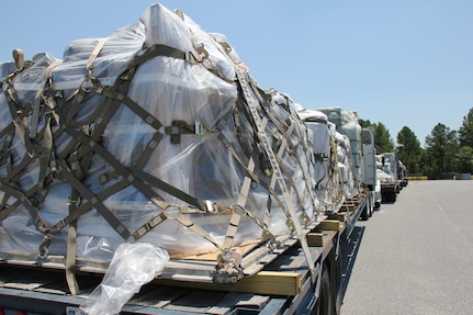 ROBINS AIR FORCE BASE, Ga. -- Four flatbed trucks loaded with communications equipment stand ready here June 28. The 51st CBCS is postured and on-call with nearly 123,000 pounds of communications equipment to support wildfire operations in Colorado. (U.S. Air Force photo by Robert Talenti) 