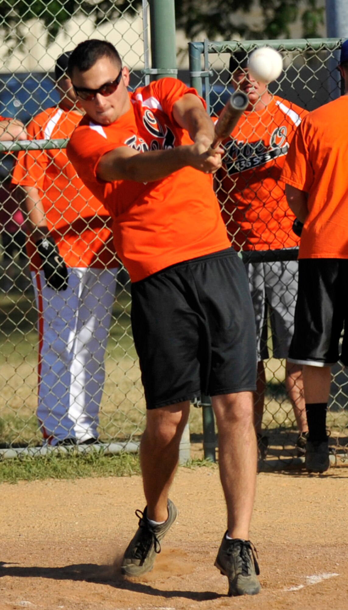 Casey Wheatley, the extra hitter with the 436th Security Forces Squadron A team, smashes a single during an American League intramural softball game against the 436th SFS B team July 2, 2012, at Dover Air Force Base, Del. Wheatley went 2-for-2 as the 436th SFS A team waxed the 436th SFS B team 13-1 in four innings. (U.S. Air Force photo by Tech. Sgt. Chuck Walker)