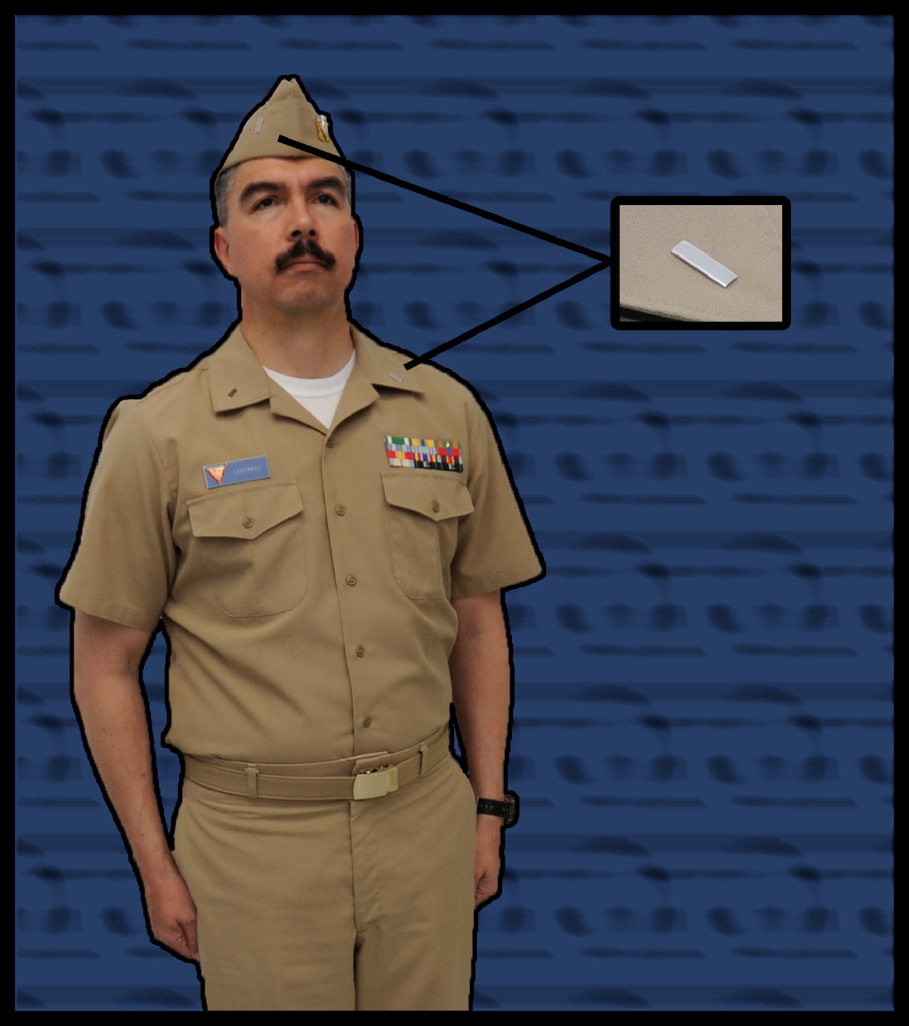 U.S. Navy Lt. j.g. Jerry Cottrel, Naval Air Facility Misawa training officer, displays the Navy Service Khaki uniform at Misawa Air Base, Japan, June 28, 2012. The insignia for the uniform are located on the right side of the garrison cap and on both sides of the collar. (U.S. Air Force graphic by Airman 1st Class Kaleb Snay/ Released)