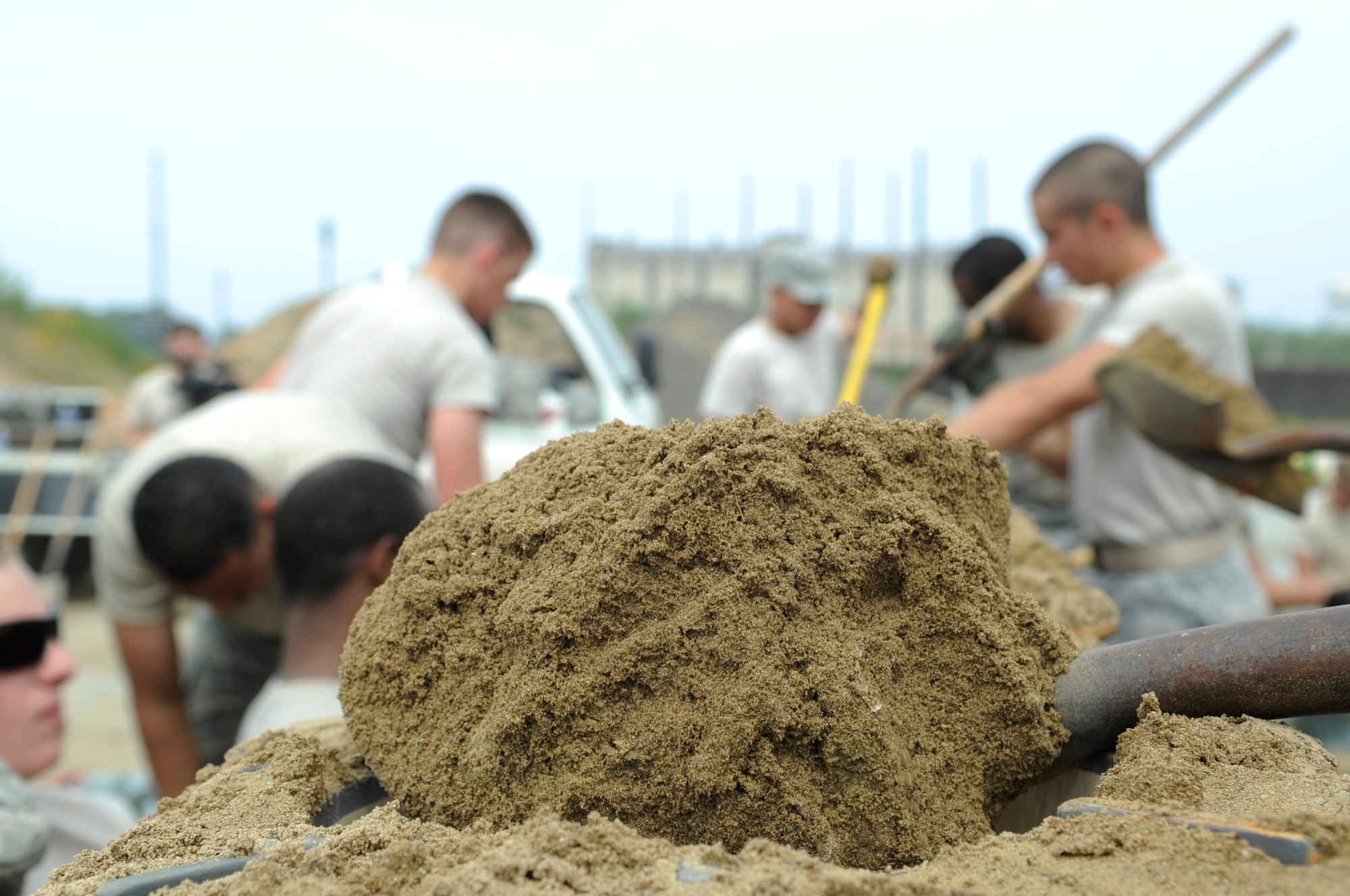 Airmen from around the Wolf Pack work hard June 29, 2012, at Kunsan Air Base, Republic of Korea, to get the base ready for monsoon season. The 5,000 sandbags are placed near critical assets on base and will be used during heavy rains to prevent flooding.  (U.S. Air Force photo/Senior Airman Brigitte N. Brantley)