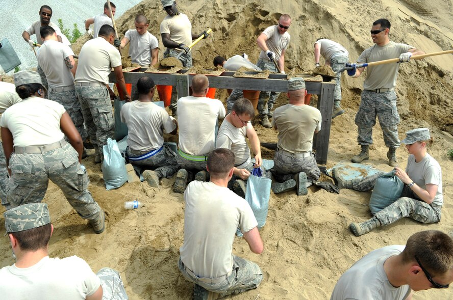 Airmen from the 8th Fighter Wing fill sandbags June 29, 2012, at Kunsan Air Base, Republic of Korea, to prepare for monsoon season. The rain that falls over the next month will account for around 50 percent of the area’s annual precipitation. (U.S. Air Force photo/Senior Airman Brigitte N. Brantley)