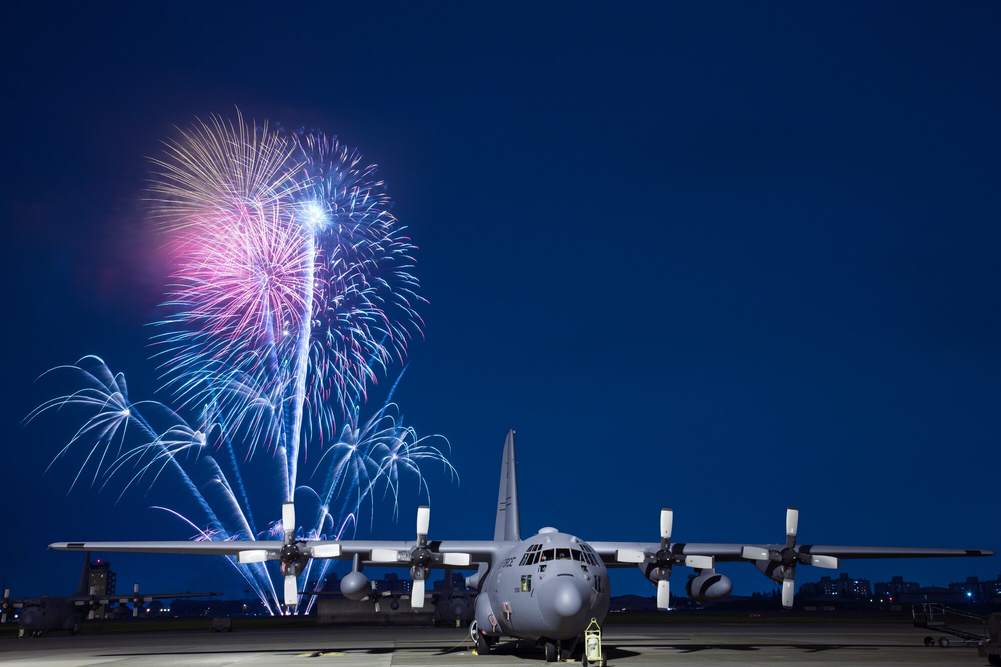 YOKOTA AIR BASE, Japan -- Fireworks burst over Yokota Air Base, Japan, on July 4, 2012, during Celebrate America. The 374th Force Support Squadron provided Yokota residents and their guests with events for all ages. The day kicked off with the Firecracker 5K run and a variety of activities throughout the day to include go karts, pony rides, live entertainment, food and fireworks. (U.S. Air Force photo illustration by Osakabe Yasuo)