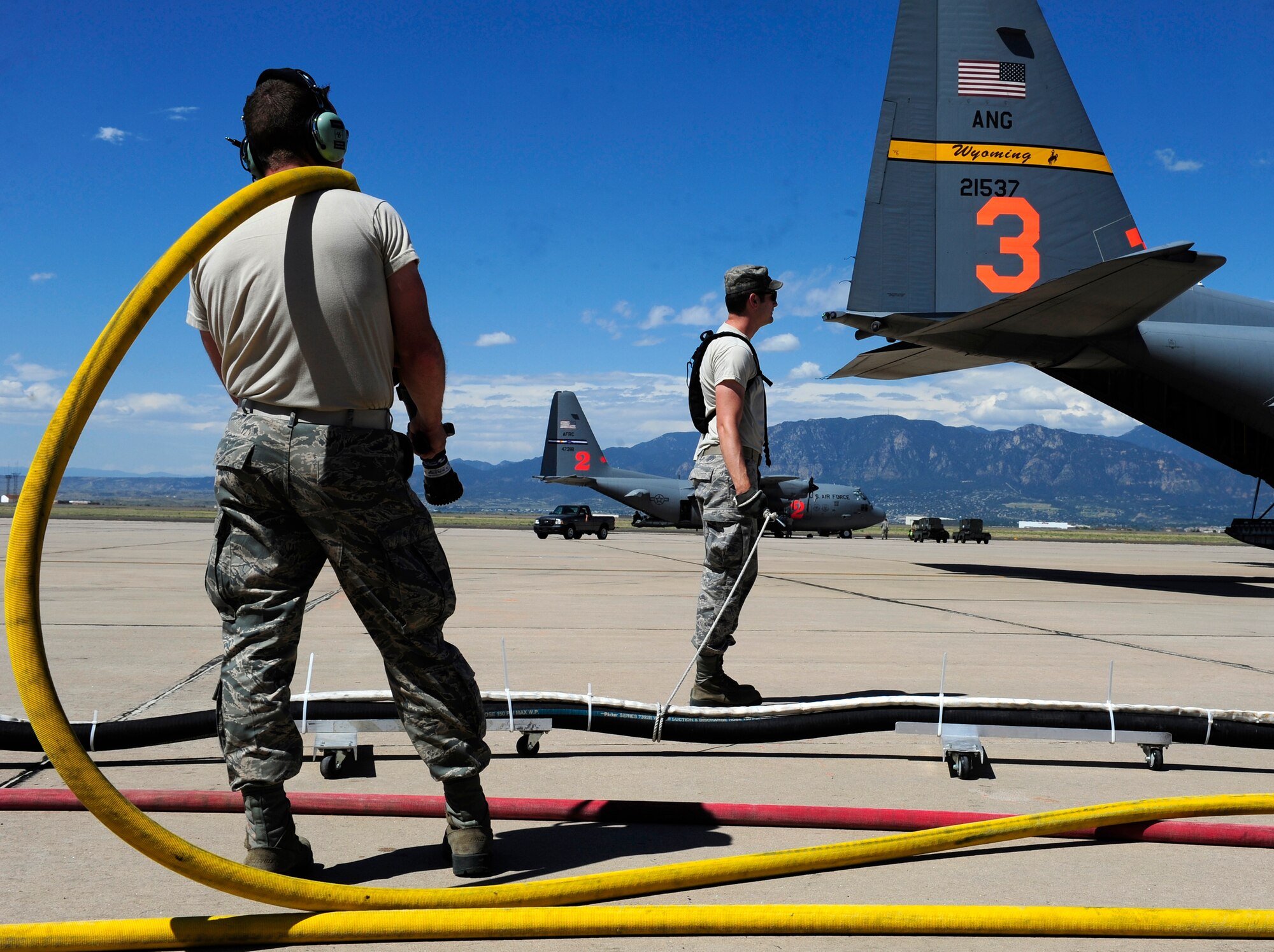 Air Force Reservists from the 302nd Airlift Wing provide critical ground support June 27 while assisting the Modular Airborne Fire Fighting System aerial firefighting response at Peterson Air Force Base to the Waldo Canyon Fire in Colorado Springs, Colo. MAFFS is a self-contained aerial firefighting system that can discharge 3,000 gallons of water or fire retardant in less than five seconds, covering an area one-quarter of a mile long by 100 feet wide. Peterson AFB is an Air Force installation located in southern Colorado. (U.S. Air Force photo/Staff Sgt. Stephany D. Richards)